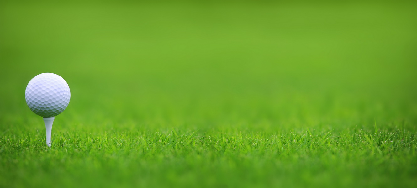 Golf ball on green grass background - Vancouver DMC Golf ball on green grass background - Vancouver DMC